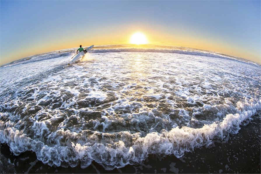 Heading out into the waves in Gold Coast Australia