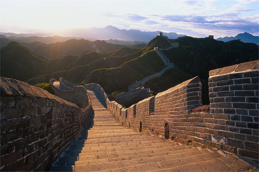 view of the great wall of china at sunset