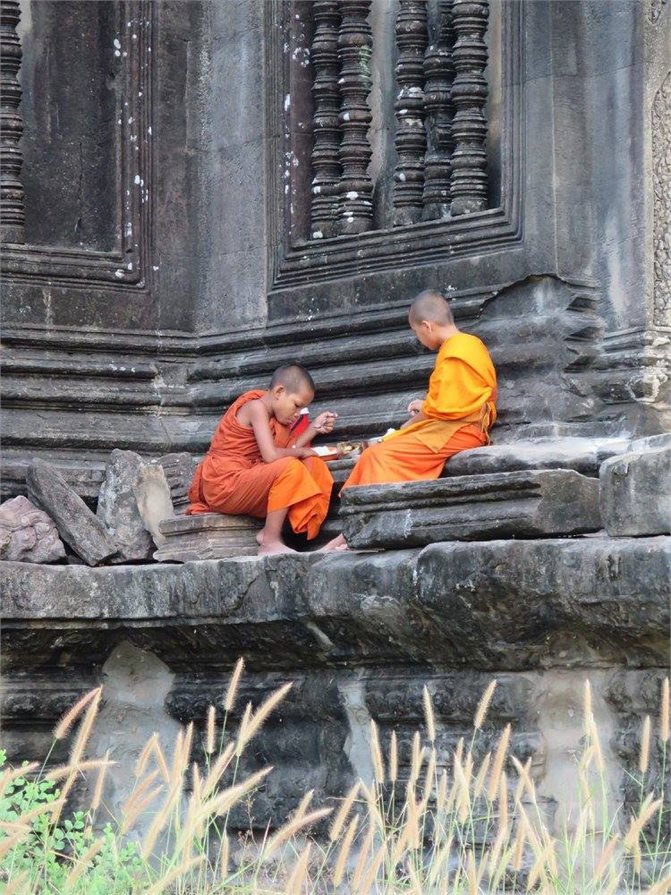 Young boys sitting on the temple steps