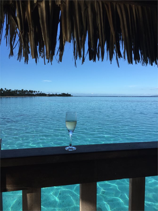 Enjoying a glass of wine by the oceans of Moorea